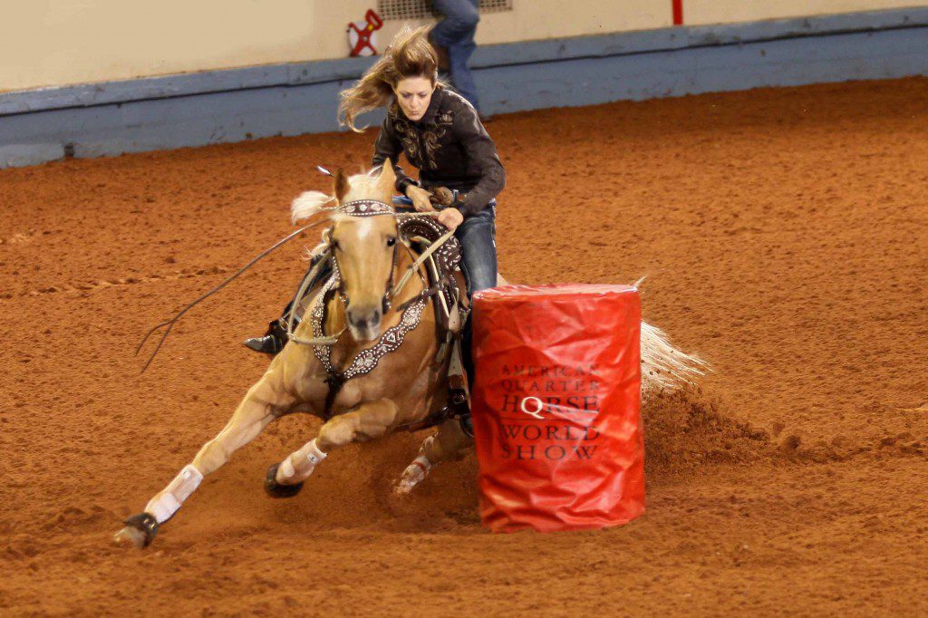 During her first trip to the AQHA World Championship Show, Jennifer Marie Arnold of Smyrna, Tennessee, captured the 2013 amateur barrel racing world championship with her mare Paris Firewater. The duo also set a record time for the class – :16.008 seconds. Photo courtesy AQHA.
