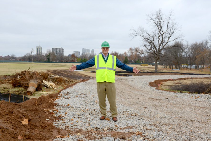 Jeff Stava, executive director of Tulsa’s Gathering Place, Llc, stands on land near riverside drive that eventually will be transformed into a gathering place. Photo by Natalie Green.
