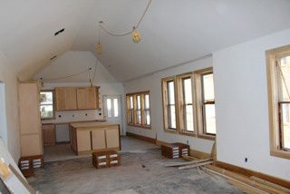 Walls seperating the living room, dining room and kitchen were removed to create one large space. Photos courtesy John Beedon.