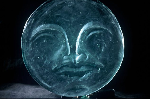 Moon sconce at the exit of the Our Universes exhibition. Photo by Maxwell MacKenzie, courtesy Smithsonian NMAI.