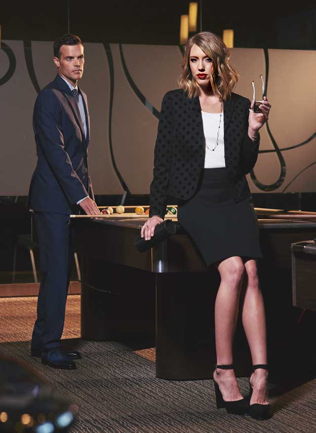 On Madeline: Akris Punto jersey dot black jacket, $1390; St. John white jersey scoop neck tank, $195; Akris Punto black flounce skirt, $495; Jimmy Choo platform heels, $925; Jimmy Choo lame glitter trinket clutch, $1050; Alexis Bittar crystal-encrusted custom link station necklace, $195; Alexis Bittar crystal encrusted gold earrings, $175; Alexis Bittar crystal crusted link ring, $125; Alexis Bittar crystal encrusted oversize link cuff bracelet, $225; Alexis Bittar crystal encrusted link bracelet, $145, all from Saks Fifth Avenue. Face a Face white and black sunglasses, $530, Hicks Brunson. On Kyle: Jack Victor navy suit jacket, $598; Jack Victor suit trousers, $228; Saks Fifth Avenue striped twill dress shirt, $188; Canepa diamond print tie, $125; Torino black belt, $98, One piece Balmore shoes, $478, all from SAKS Fifth Avenue.