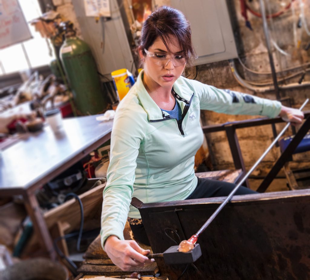 Cara Fitzgerald learns glass blowing from Andy Boatman at Blue Sage Studios.