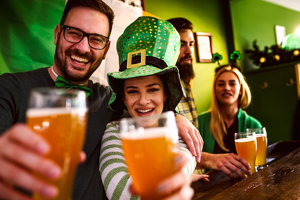 Group of Friends Celebrating St Patrick's Day in Beer Pub