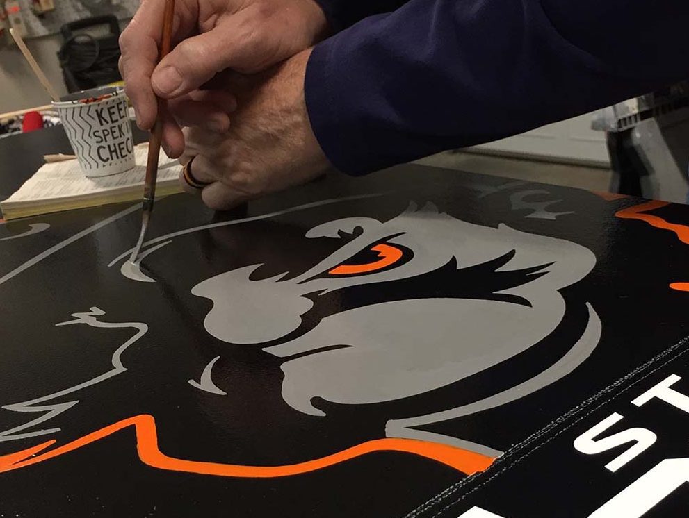 Along with logo design, Whitfield also enjoys painting and lettering.