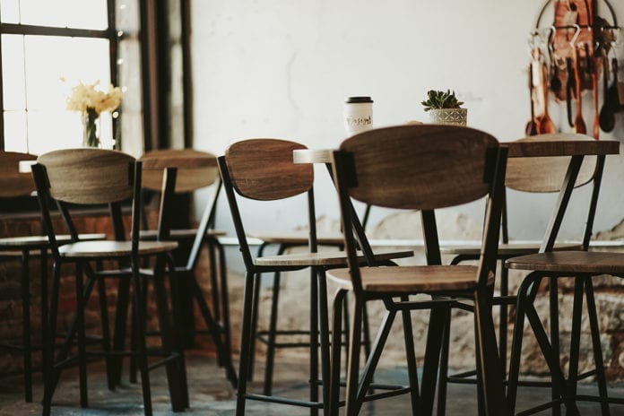 Bar stool seating occupies one corner of the Oasis Coffee House.