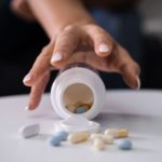 Drug Addicted Woman Reaching For Medication